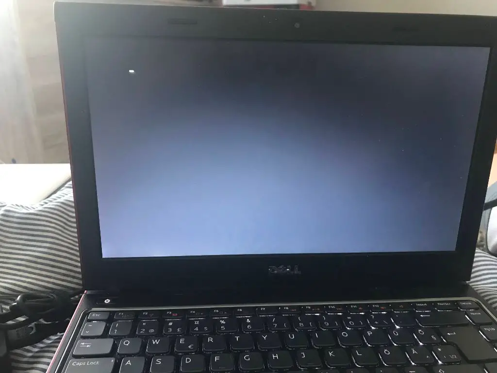 Why is my laptop stuck on a black screen