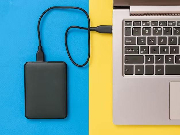 How do I make an external hard drive compatible with my Mac and PC