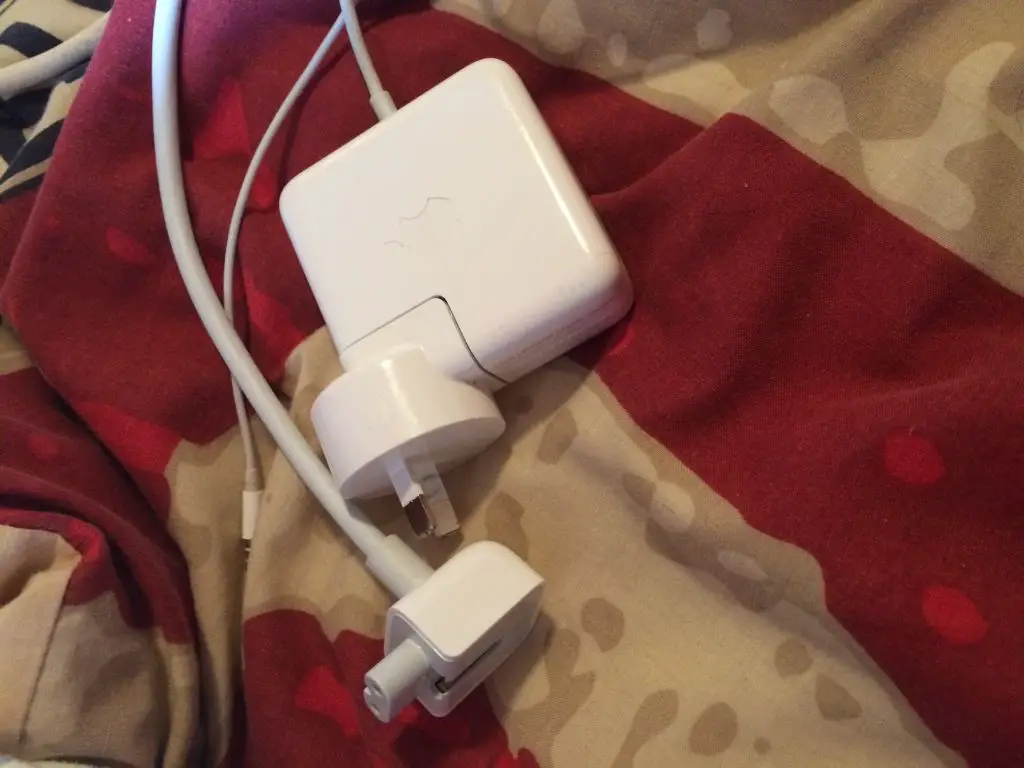 How do I remove the plug from my MacBook charger