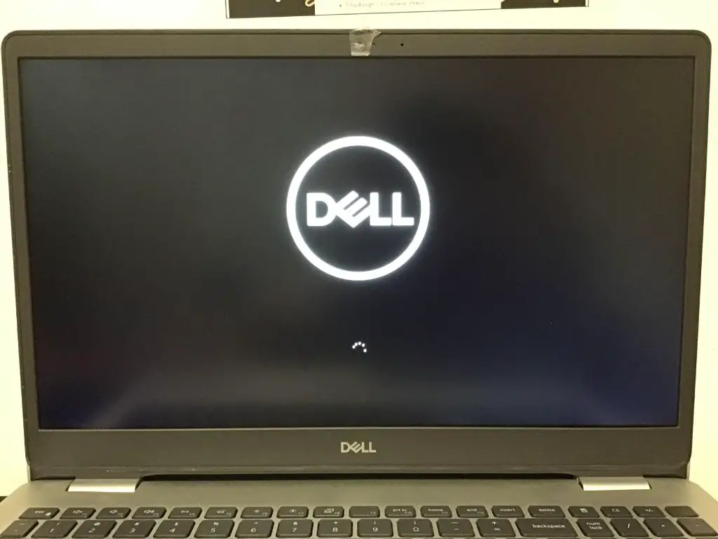 How do I force a frozen Dell laptop to shut down